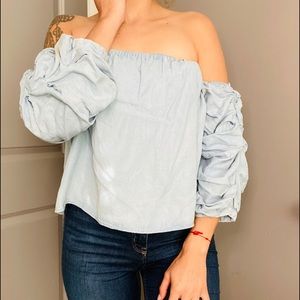 OF-THE-SHOULDER RUFFLED DENIM SHIRT